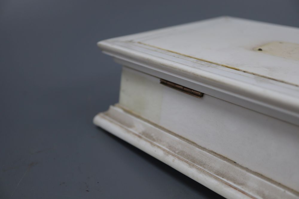 An ivory box with gold hinges, width 17cm height 8cm